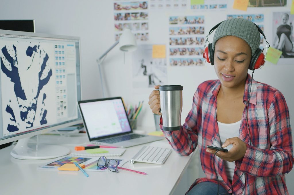 Trendy worker relaxing at workplace